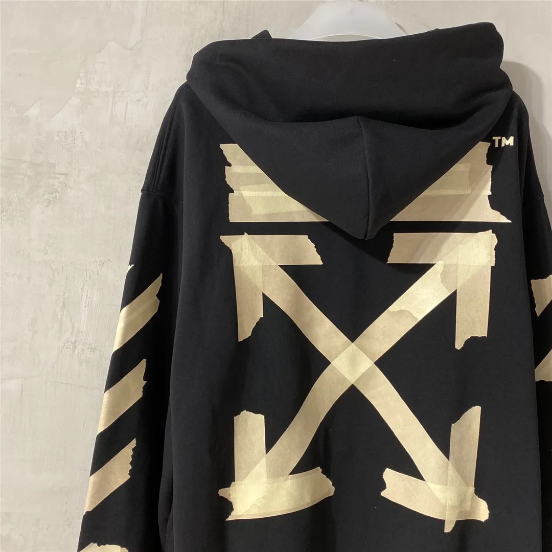 Spring and autumn top tested version OFF WHITE OW hot stamping strip printing male and female couples pure cotton loose same style pullover hooded sweatshirt The printing is done on a Japanese-owned Mimaki printing machine, with no edges or burrs. Inkjet heat transfer is hot-pressed and cold-teared, and the high temperature is 180 degrees. The front piece needs to be pressed twice (the second time requires 180kg of air pressure). The transparent fabric is anti-scratch and ironing, and the printing is fog-free. The semi-transparent tape in the front circle can reveal the part of the printing underneath. The golden printing color of the tape is not The flat color and tape printing overlap have different color depths. The wash label is also customized according to the original font. The accessories still use the full line of correct accessories. The rectangular woven collar label design is cancelled. The previous three-dimensional silicone feel font is changed to a fully woven collar label. Fluorescent fonts can be seen on the collar label. The five-link silicone hangtag, three-link washable label and zebra crossing packaging line are still the same. 480g pure cotton terry fabric, a major launch with full drape. A full set of customized accessories, one-to-one mold opening, professional ow. Size: XS-L Size chart